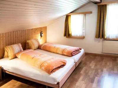 Ein Bett oder Betten in einem Zimmer der Unterkunft Apartment Wiedersehen by Interhome