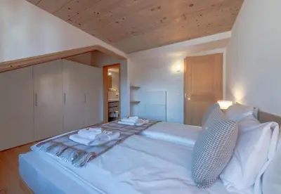 Ein Bett oder Betten in einem Zimmer der Unterkunft Chalet Belmont Penthouse