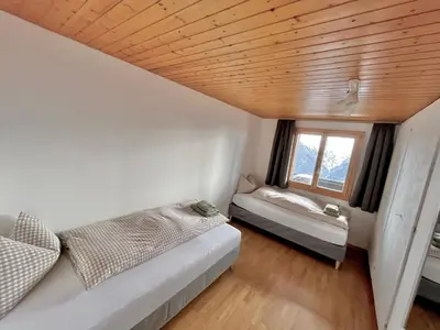Ein Bett oder Betten in einem Zimmer der Unterkunft Chalet Talblick