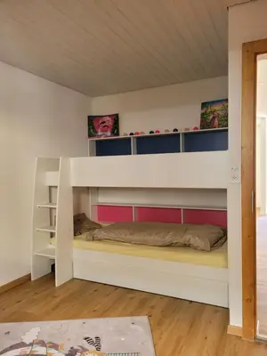 Ein Bett oder Betten in einem Zimmer der Unterkunft 3.5-Zimmer FeWo Primeli Fieschertal