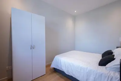 Ein Bett oder Betten in einem Zimmer der Unterkunft Visp Gem for 6