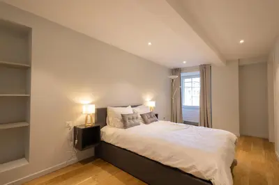 Ein Bett oder Betten in einem Zimmer der Unterkunft Visp Gem for 6