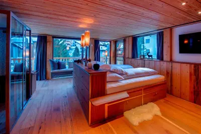 Ein Bett oder Betten in einem Zimmer der Unterkunft Luxury Chalet by Heinz Julen