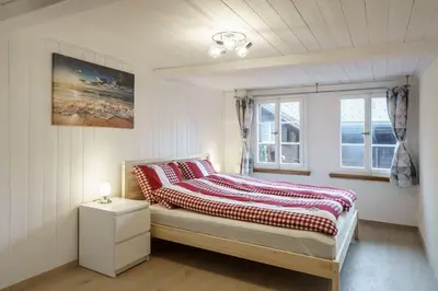 Ein Bett oder Betten in einem Zimmer der Unterkunft StayBrienz - Lake Brienz Holiday House