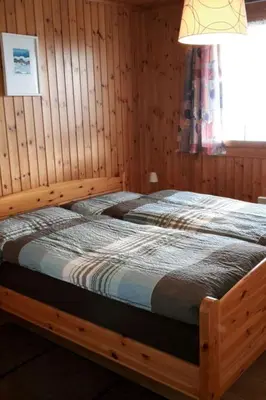 Ein Bett oder Betten in einem Zimmer der Unterkunft Apartment Konkordia 2 EG Süd-Ost by Interhome