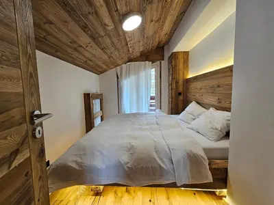 Ein Bett oder Betten in einem Zimmer der Unterkunft Magnifique attique avec vue sur le lac de la Moubra