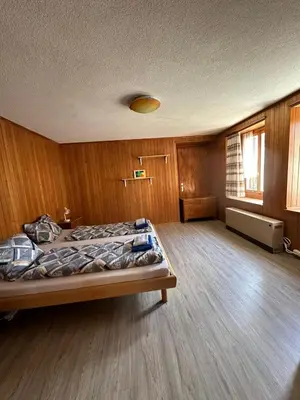 Ein Bett oder Betten in einem Zimmer der Unterkunft Wetterhorn