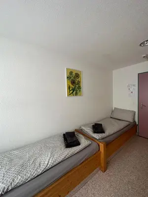 Ein Bett oder Betten in einem Zimmer der Unterkunft Touristenheim Bergfreude