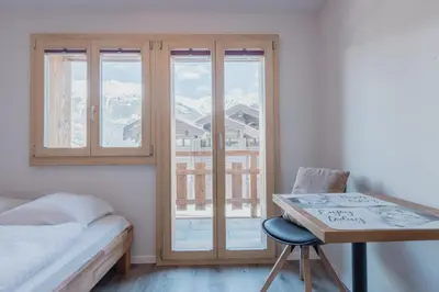 Ein Bett oder Betten in einem Zimmer der Unterkunft Chaleureux studio rénové à Grimentz