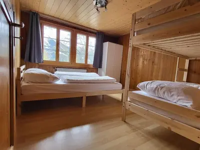 Ein Bett oder Betten in einem Zimmer der Unterkunft Chalet Engi Apt. 3 for up to 8 People