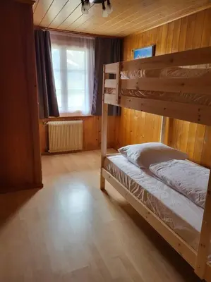 Ein Bett oder Betten in einem Zimmer der Unterkunft Chalet Engi Apt. 3 for up to 8 People