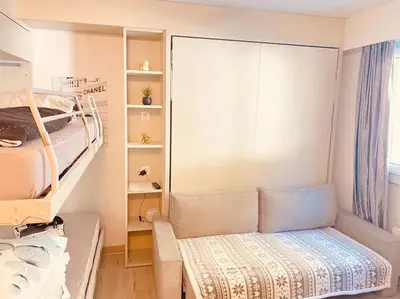 Ein Bett oder Betten in einem Zimmer der Unterkunft Crans Montana - Studio au pied du téléphérique