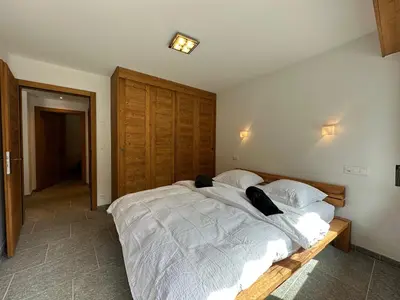 Ein Bett oder Betten in einem Zimmer der Unterkunft Snowstar-Next to ski lift and golf-Crans Montana