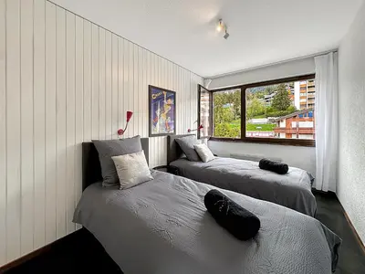 Ein Bett oder Betten in einem Zimmer der Unterkunft Instant Ski and Golf Paradise - Crans Montana