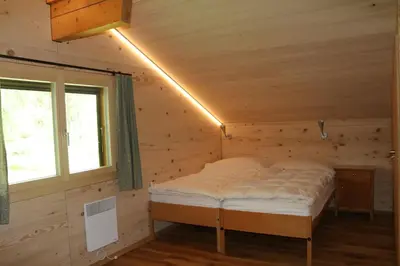 Ein Bett oder Betten in einem Zimmer der Unterkunft Chalet Männertreu OG