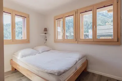 Ein Bett oder Betten in einem Zimmer der Unterkunft Studio à 2 minutes des remontées mécaniques