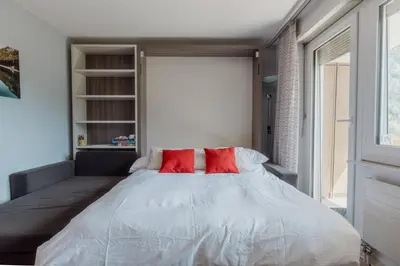 Ein Bett oder Betten in einem Zimmer der Unterkunft Appartement proche des remontées mécaniques