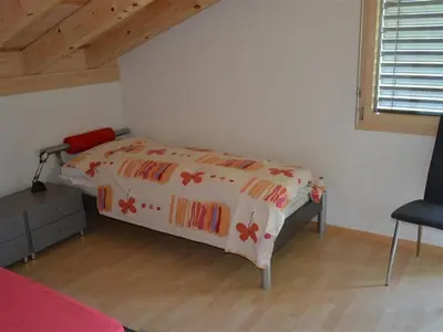 Ein Bett oder Betten in einem Zimmer der Unterkunft Apartment Alpha by Interhome