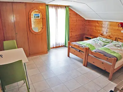 Ein Bett oder Betten in einem Zimmer der Unterkunft Apartment Bergfink Dachgeschoss-3 by Interhome