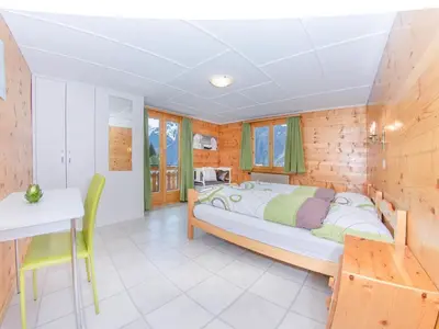 Ein Bett oder Betten in einem Zimmer der Unterkunft Apartment Bergfink Obergeschoss-4 by Interhome
