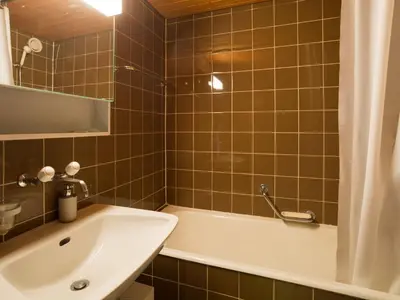 Ein Badezimmer in der Unterkunft Apartment Combire 210 by Interhome