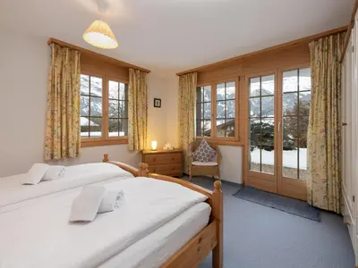 Ein Bett oder Betten in einem Zimmer der Unterkunft Apartment Chalet Hori-2 by Interhome