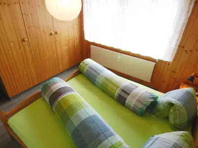 Ein Bett oder Betten in einem Zimmer der Unterkunft Apartment Résidence Sonnegg - Vuilleumier by Interhome