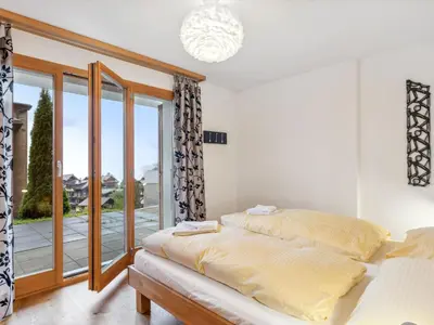 Ein Bett oder Betten in einem Zimmer der Unterkunft Apartment Fortuna Apt-M by Interhome