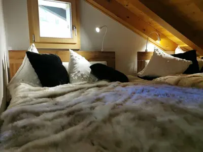Ein Bett oder Betten in einem Zimmer der Unterkunft Charmante Loft Wohnung in den Bergen