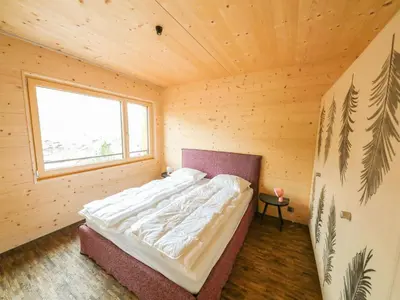 Ein Bett oder Betten in einem Zimmer der Unterkunft Apartment Sparenmoos - OG - DG Nord-Ost by Interhome