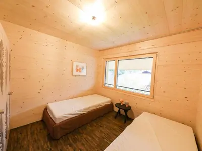 Ein Bett oder Betten in einem Zimmer der Unterkunft Apartment Sparenmoos - OG - DG Nord-Ost by Interhome