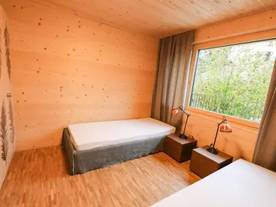 Ein Bett oder Betten in einem Zimmer der Unterkunft Apartment Brunnhorn EG Nordost by Interhome