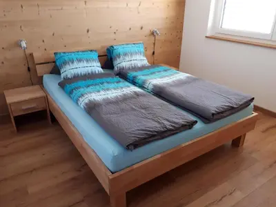 Ein Bett oder Betten in einem Zimmer der Unterkunft Apartment Robert 1- OG Süd by Interhome