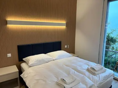 Ein Bett oder Betten in einem Zimmer der Unterkunft Lake Music