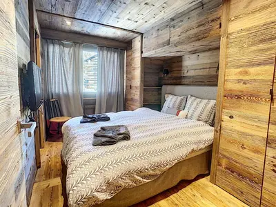 Ein Bett oder Betten in einem Zimmer der Unterkunft Crans-Montana Luxe & Charme Appartement - Ski in & Out