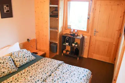 Ein Bett oder Betten in einem Zimmer der Unterkunft Chalet Tzarbonire