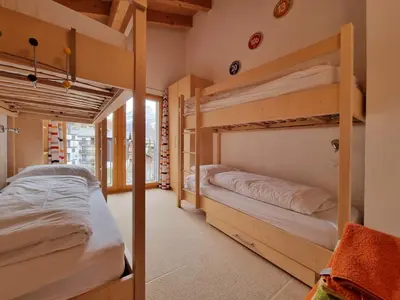 Ein Bett oder Betten in einem Zimmer der Unterkunft Snowfun B Penthouse