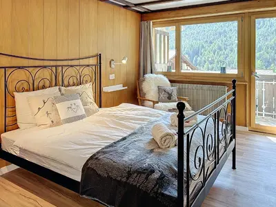 Ein Bett oder Betten in einem Zimmer der Unterkunft Appartement STERN - Confort au coeur de Saas-Fee
