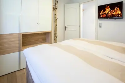 Ein Bett oder Betten in einem Zimmer der Unterkunft Haus Andorra mit Matterhornblick