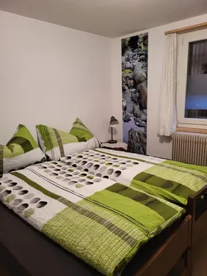 Ein Bett oder Betten in einem Zimmer der Unterkunft Ferienhaus Bärschwendi