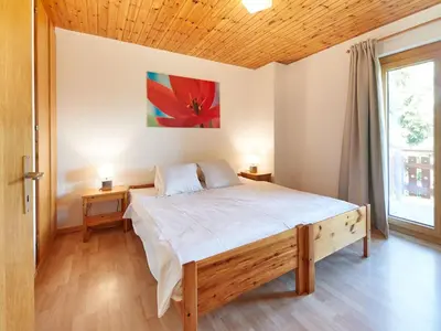 Ein Bett oder Betten in einem Zimmer der Unterkunft Chalet Lilas by Interhome