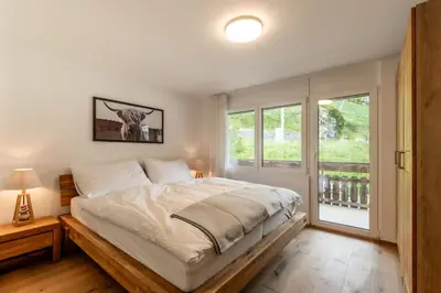 Ein Bett oder Betten in einem Zimmer der Unterkunft Stylish Apt by Ski Bus, Train and Village Center