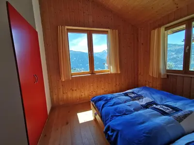 Ein Bett oder Betten in einem Zimmer der Unterkunft Chalet Mélèze in sonniger Lage mit schönem Ausblick , für 6 Personen