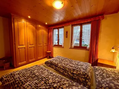 Ein Bett oder Betten in einem Zimmer der Unterkunft Gstaad Blue Sky Chalet