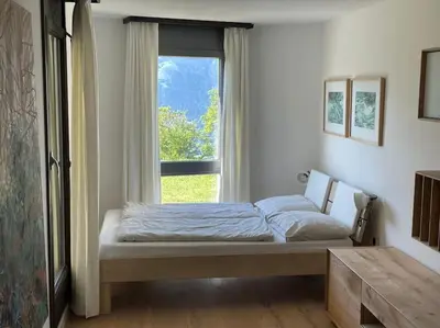 Ein Bett oder Betten in einem Zimmer der Unterkunft Apartment im 4-Sterne Berghotel über Interlaken-Thunersee