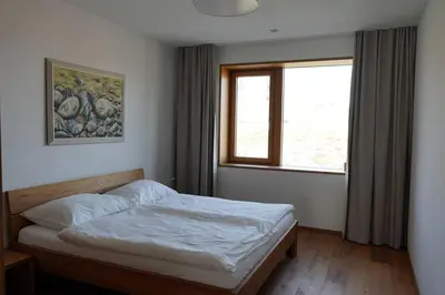 Ein Bett oder Betten in einem Zimmer der Unterkunft Exklusive Wohnung mit Panoramasicht auf Melchsee-Frutt