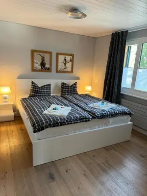 Ein Bett oder Betten in einem Zimmer der Unterkunft Eigentumswohnung in Grindelwald