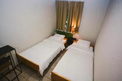 Ein Bett oder Betten in einem Zimmer der Unterkunft Alaïa Hostel