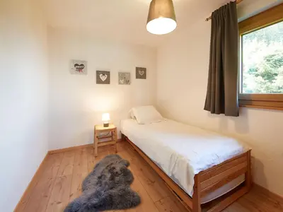 Ein Bett oder Betten in einem Zimmer der Unterkunft Chalet Fuchsia by Interhome