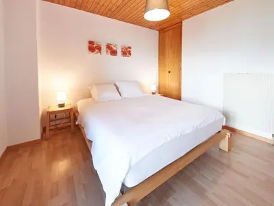 Ein Bett oder Betten in einem Zimmer der Unterkunft Chalet Fuchsia by Interhome